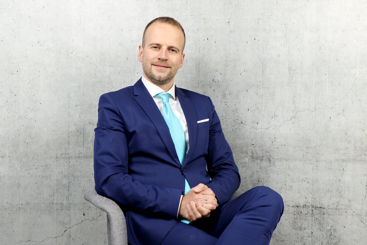 Milos Nakovski seated real estate broker portrait